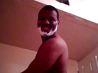 black man shaving face